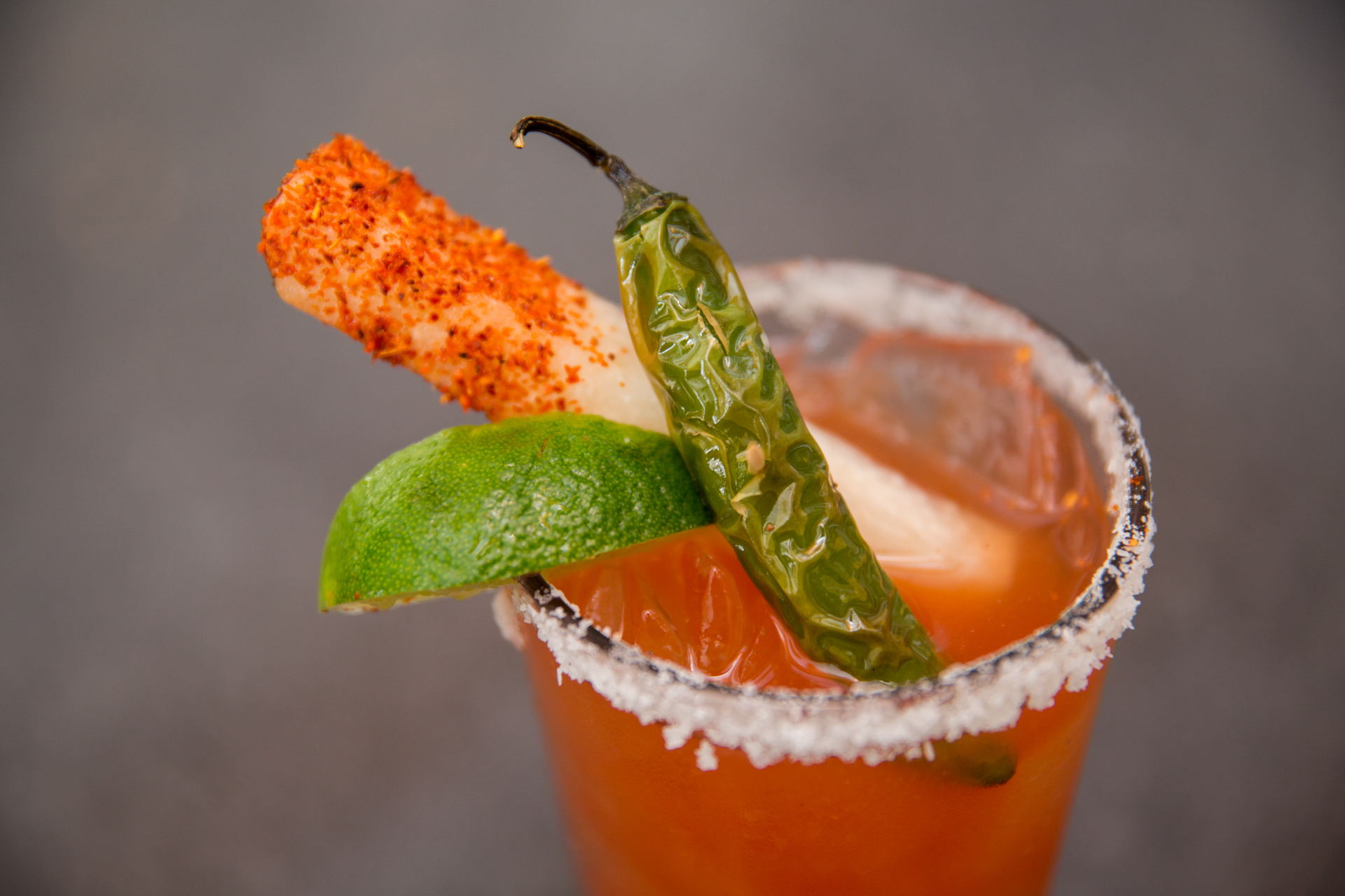 Dallas food and beverage photograph and video of a pink drink with pepper and lime.